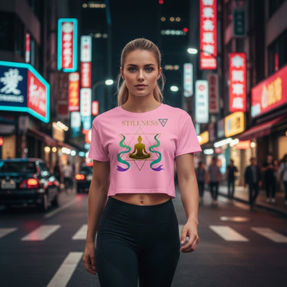 HorizonVibe pink stillness crop top worn by woman walking in neon city at night with visible zen meditation design
